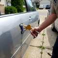 Car Dent Repair Puller being used on a car door