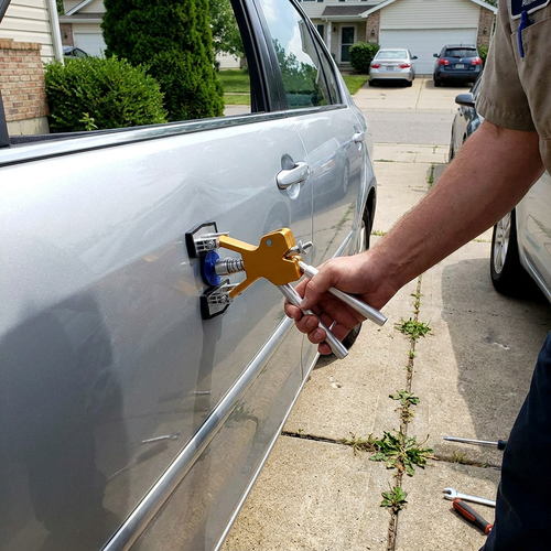 Car Dent Repair Puller being used on a car door