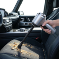 Cordless Car Vacuum being used on a car seat